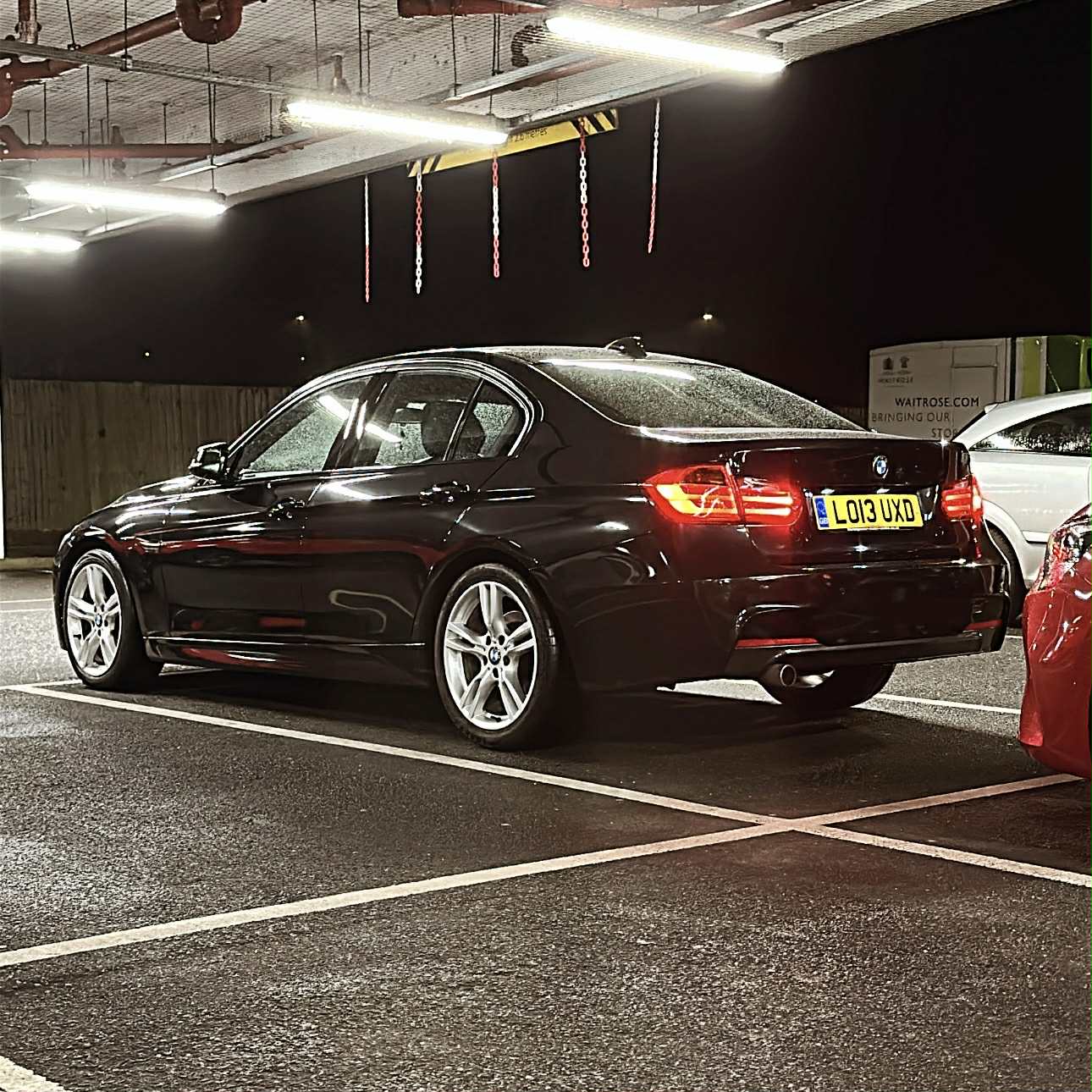 Black BMW with a deep gloss finish after a full valet